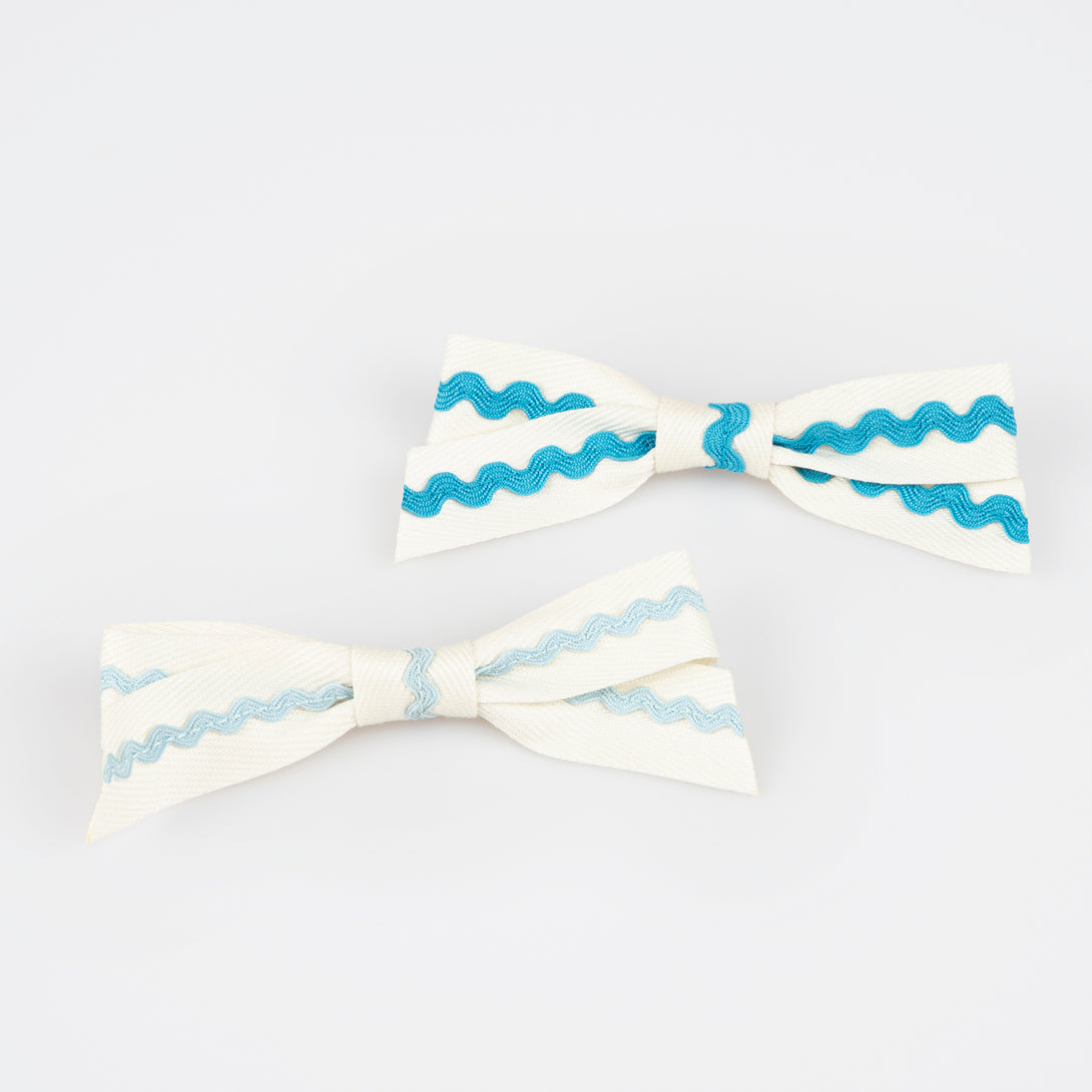 Our bow hair clips feature on-trend ric rac in pretty colors, fabulous as kids accessories.