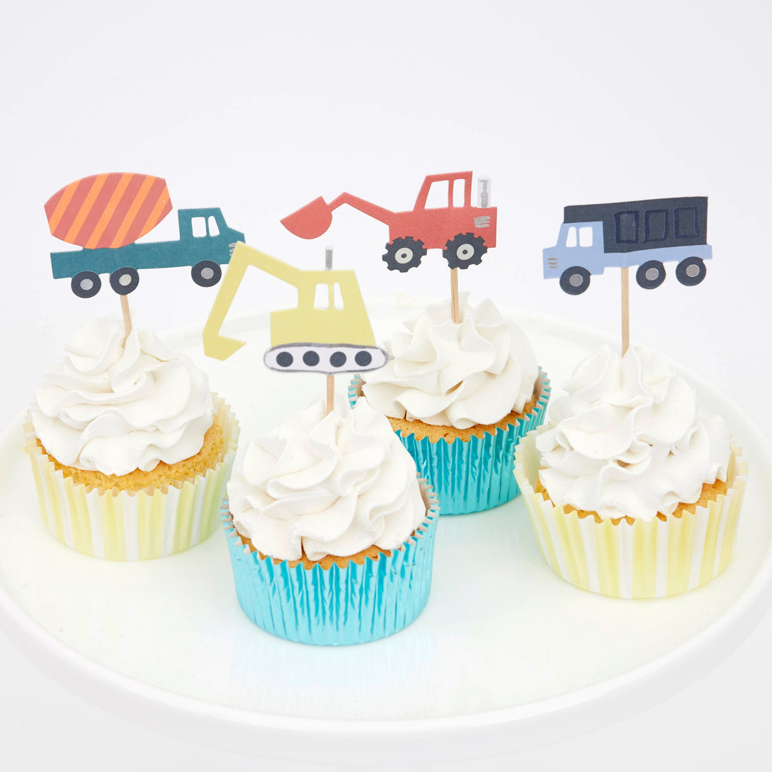 Our construction party supplies include paper plates, a 3D garland, cups, napkins, hats and a cupcake kit.