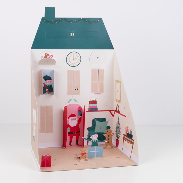 This paper doll house is designed as Santa's home, complete with his reindeer, elves, Christmas tree and gifts. Image3
