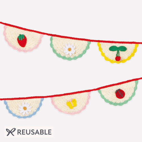 Our crochet garland features scalloped pennants with colorful designs, presented in an organza drawstring bag, a beautiful decoration. Image1
