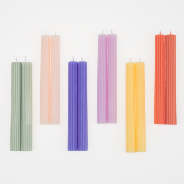 Our decorative candles in coral, pink, blue, sage and yellow will add color to your party table.