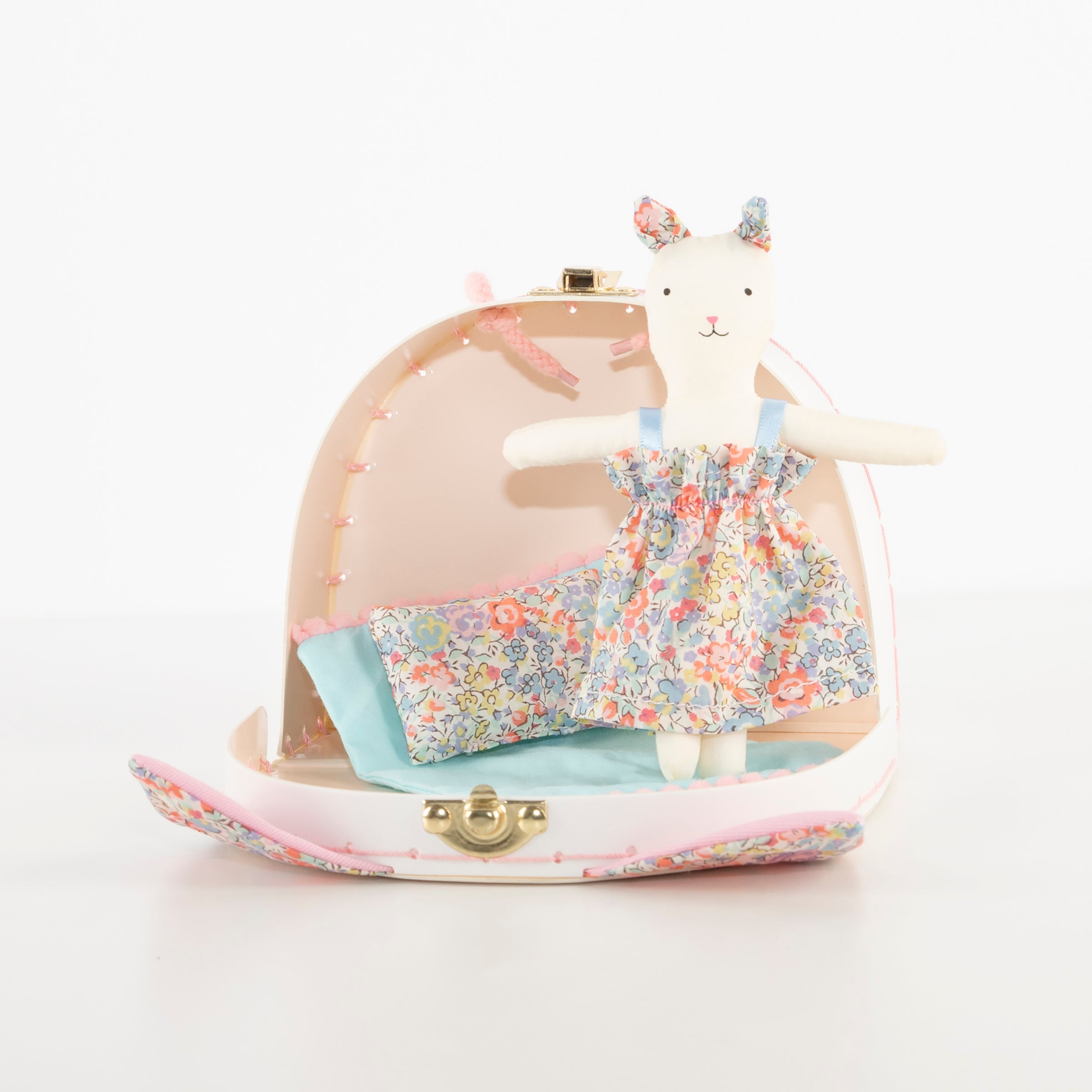 Our fabric doll and accessories, all contained in a little suitcase, is perfect to use as travel toys.