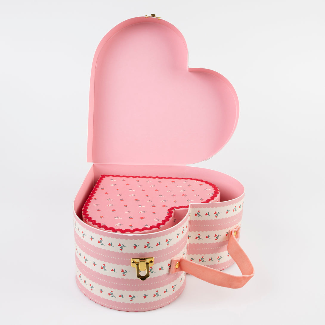 Our kids accessories feature heart suitcases in pink, red and white with soft velvet handles.