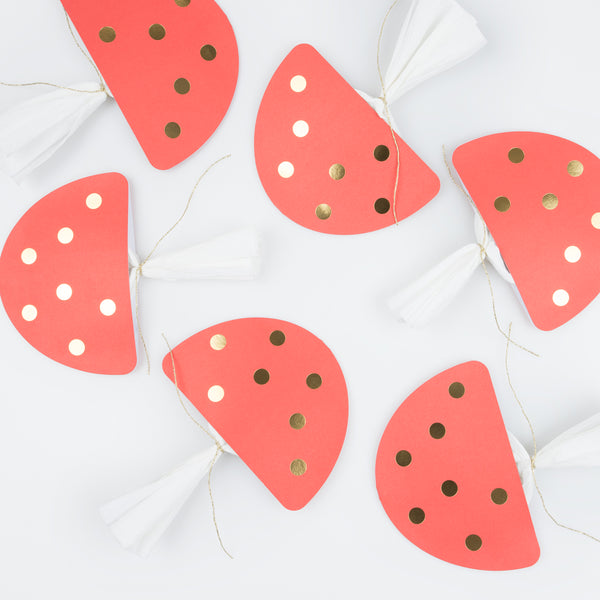 Our luxury Christmas crackers, in the shape of mushrooms, contain a red party hat, a joke and a fun enamel mushroom charm. Image4