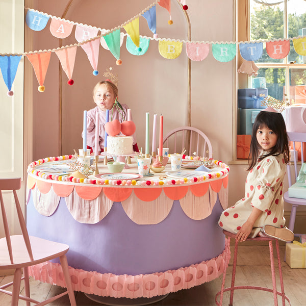 Add a pop of pastel color to your party table or wall with our flag garland with pompoms. Image2