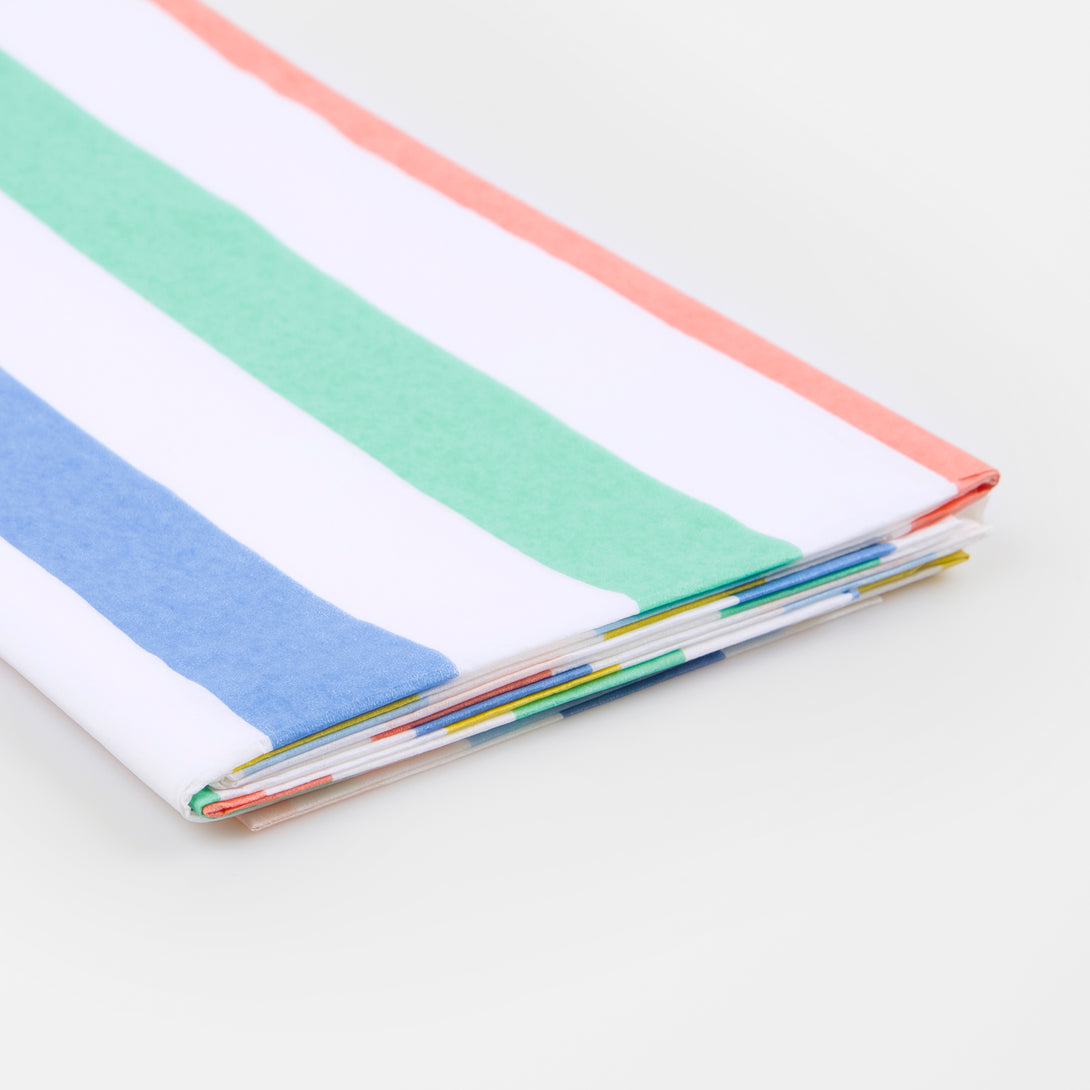 Our party tablecloth, made from laminated paper with colorful stripes, is great to add to your birthday party supplies.