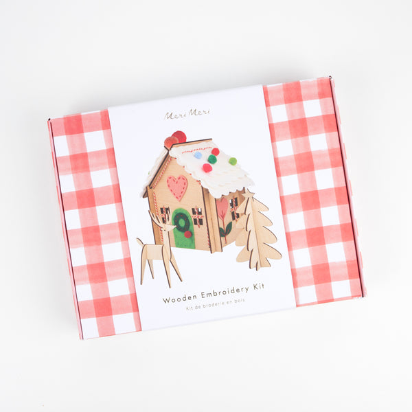 Our wooden gingerbread house features embroidery, felt and pompoms, with wooden reindeer. Perfect as a kids craft project. Image6