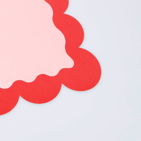 Our paper placemats are crafted in Christmas colors of red and green, with a modern pop of pink, and stylish scalloped edges. Image5