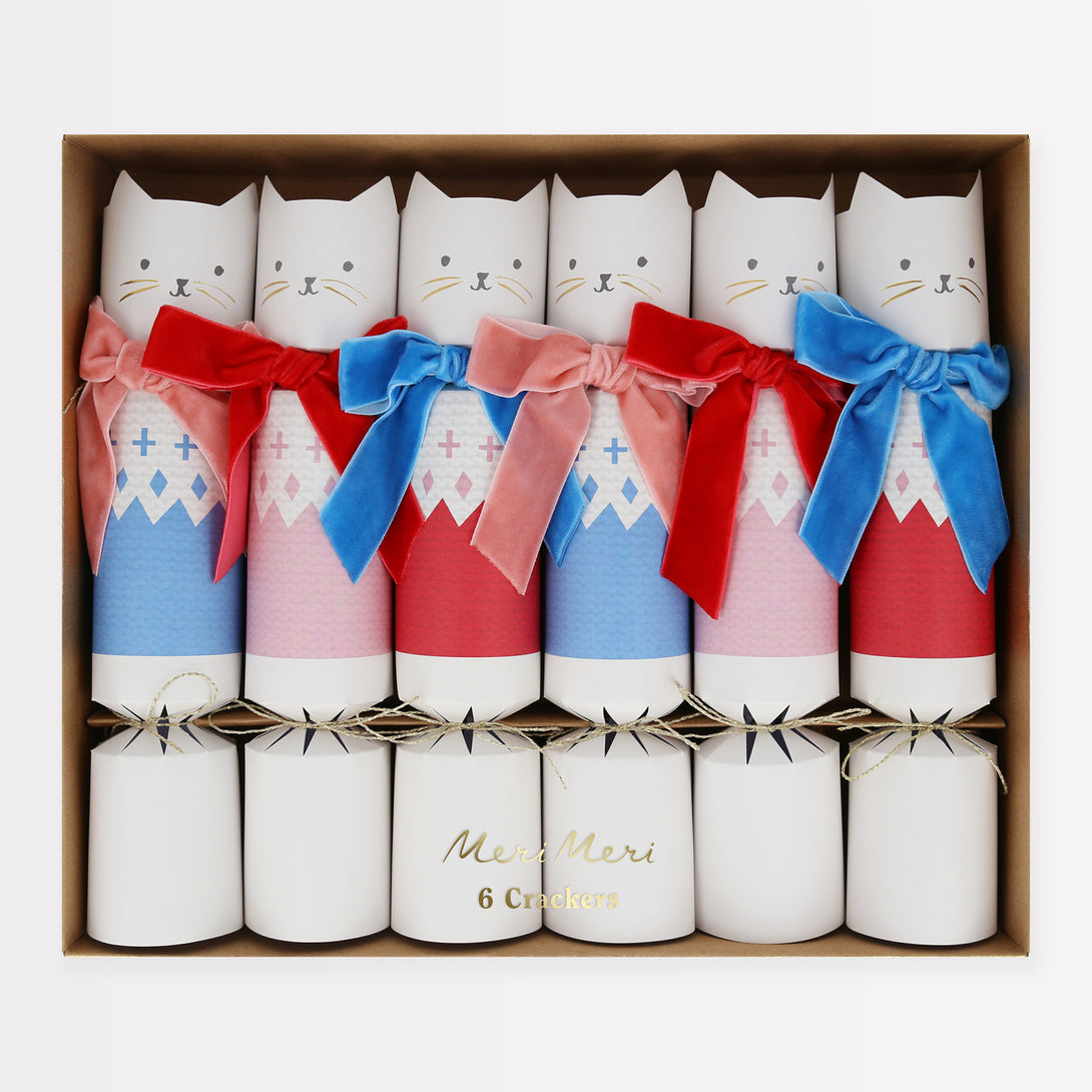 Our Christmas cat crackers look amazing, with velvet bows, and contain wooden cat brooch pins, gold party hats and funny jokes.