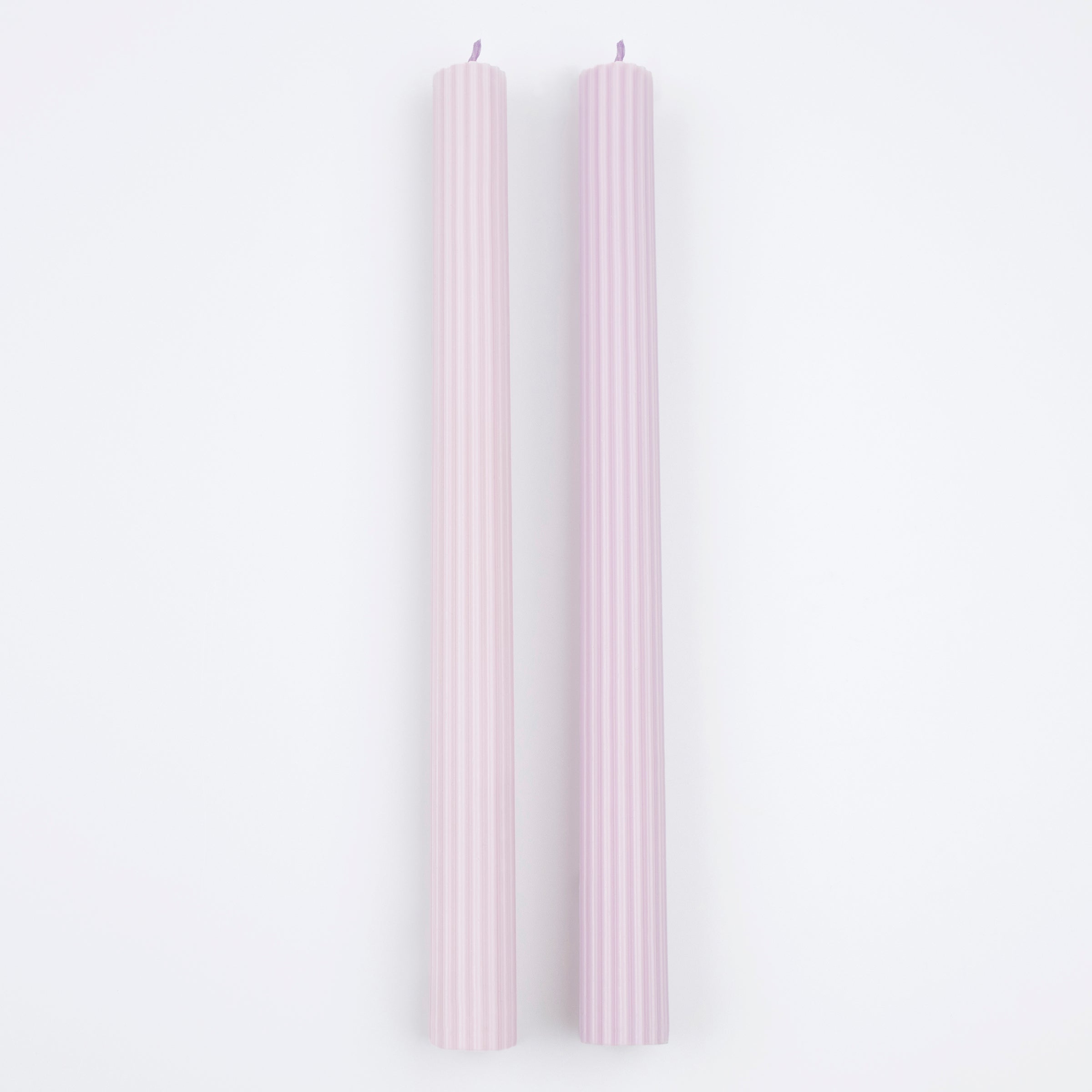 Our tall candles, in a lilac color, are perfect for any party with a purple theme.
