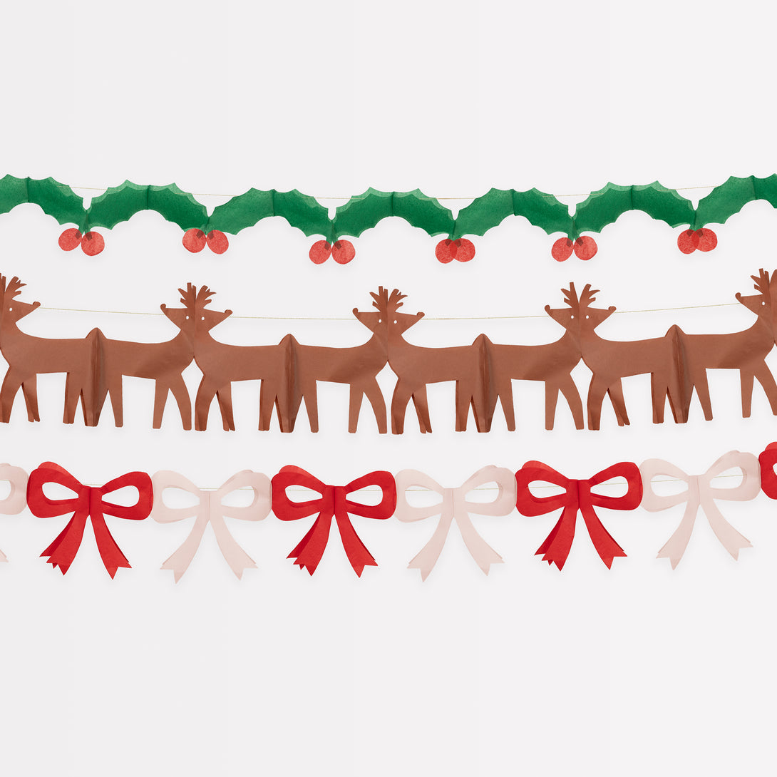 Our classic Christmas garlands, featuring reindeer, bows and holly and berries, are made with colorful tissue paper.