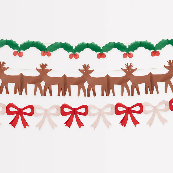 Our classic Christmas garlands, featuring reindeer, bows and holly and berries, are made with colorful tissue paper.