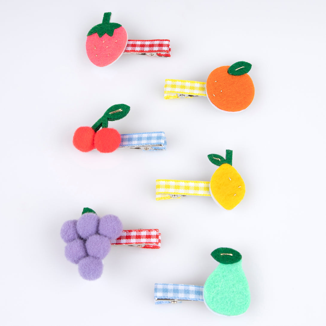 Our fruit hair clips are made from felt with fun pompoms and gingham ribbons for a really fabulous summery effect.