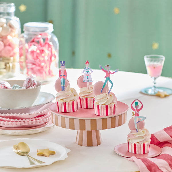 Our cupcake kit features classic Nutcracker character cake toppers and striped cupcake cases, ideal for Christmas treats. Image2
