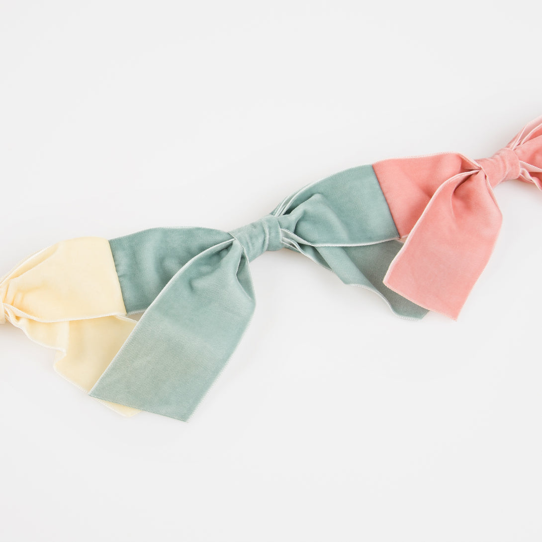 Our velvet bow fabric garland makes a special hanging decoration for a baby shower or bridal shower.