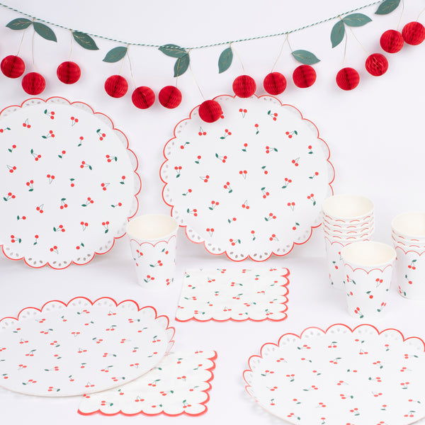 Use our special cherry party supplies for a vibrant look at your parties, our set includes paper plates, cups, napkins and a honeycomb garland. Image2