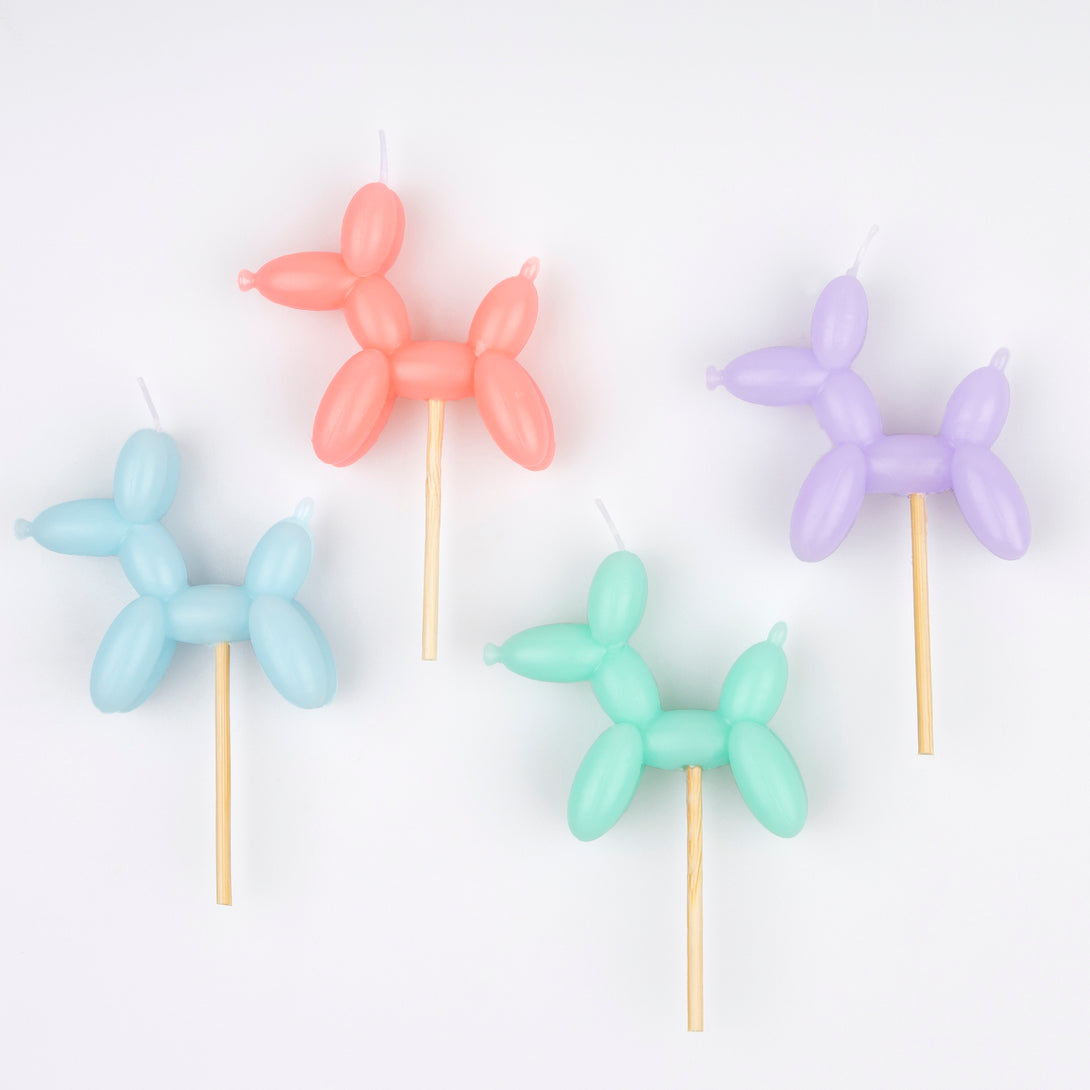 Make your birthday cake decorations look amazing with our fun candles crafted in the shapes of colorful balloon dogs.