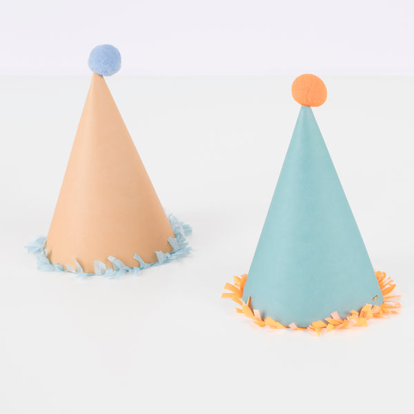 Our paper hats feature fringing, pompoms and bright colors. Image5