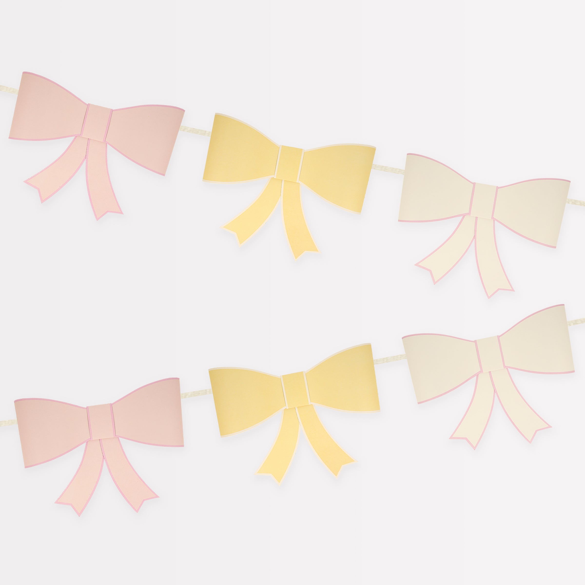 Our large garland, with big bows in soft colors, is perfect as a wall decoration.