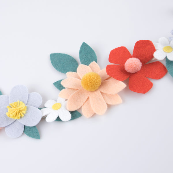 Our special party garland is crafted from felt, with flowers with pompom centers. Image3