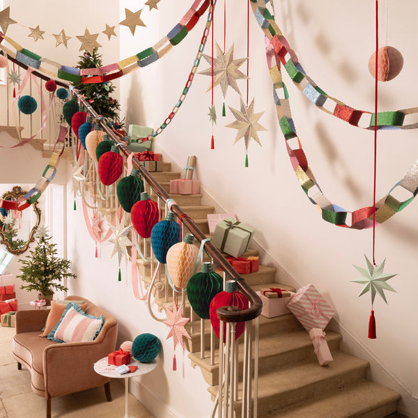 Our striped star decorations create a wonderful 3D shape, and are embellished with bright tassels and red velvet ribbons. Image2