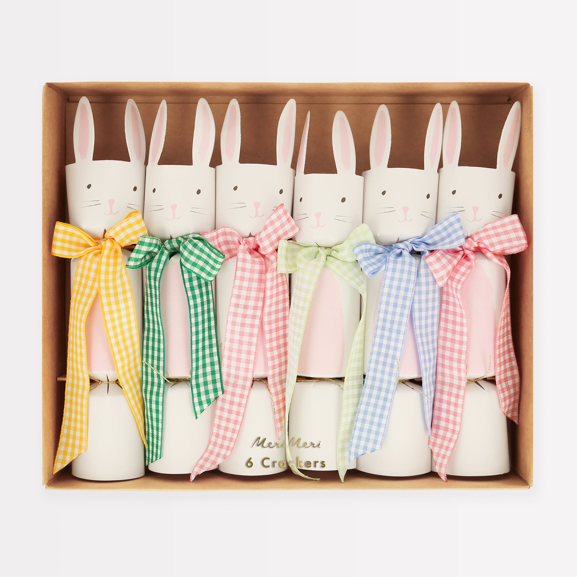 Our party crackers are crafted in the shape of bunnies, and contain mint tissue paper hats, erasers and a joke.