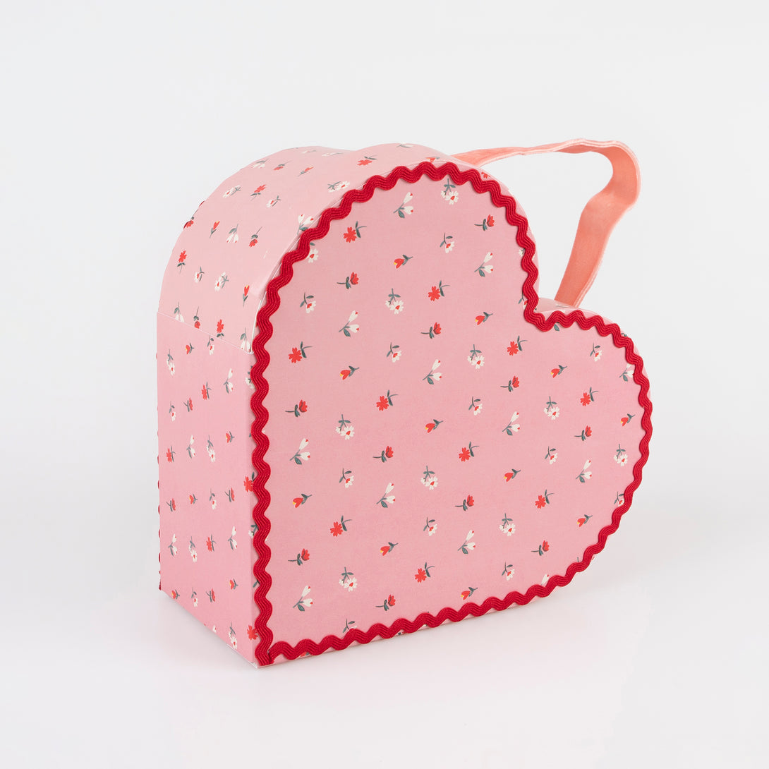 Our kids accessories feature heart suitcases in pink, red and white with soft velvet handles.