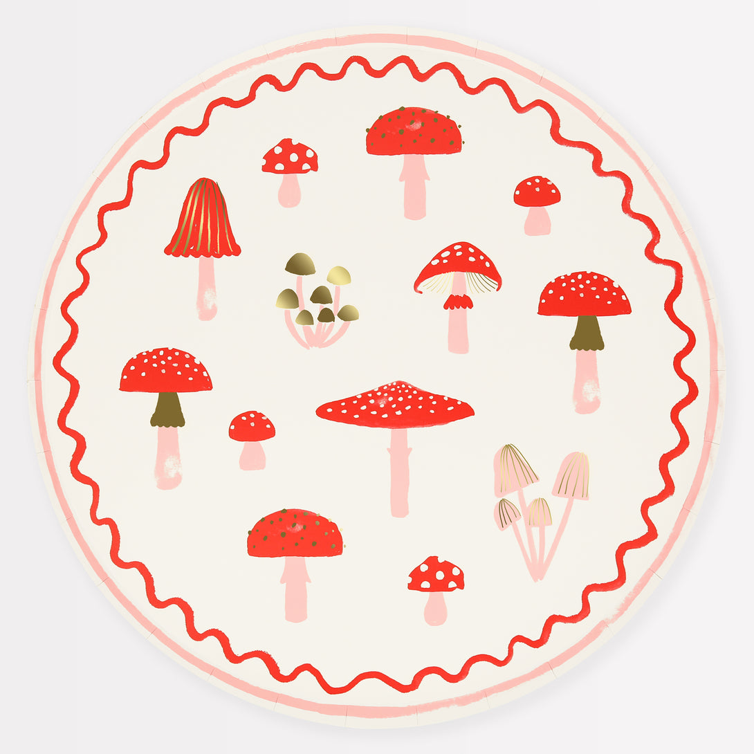 Our special Christmas party supplies include mushrooms and fairy designs on party plates, party napkins and cups, and a festive garland.