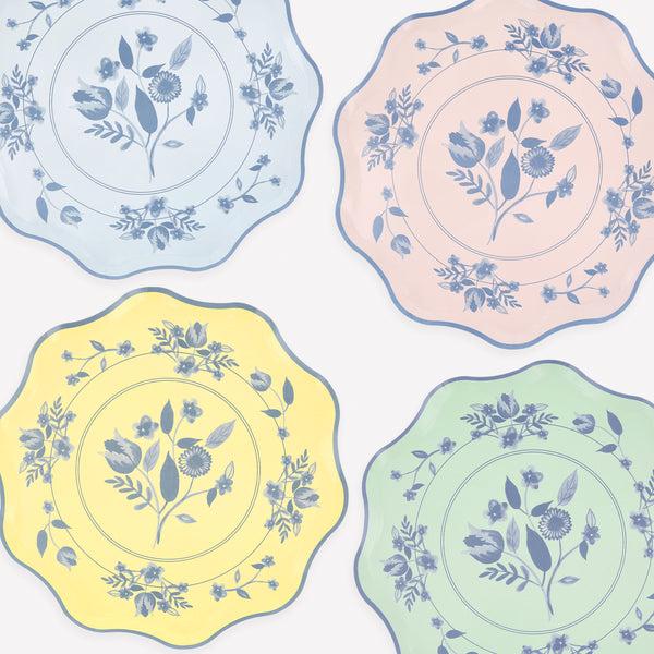 Our paper plates feature four pastel shades with cobalt blue botanical illustrations, ideal as bridal shower plates or for any grown up dinner. Image1