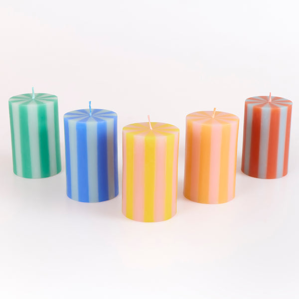 Our striped candles, in a classic pillar shape, feature 5 bright colorways and colored wicks, perfect for birthday and home decorations. Image1