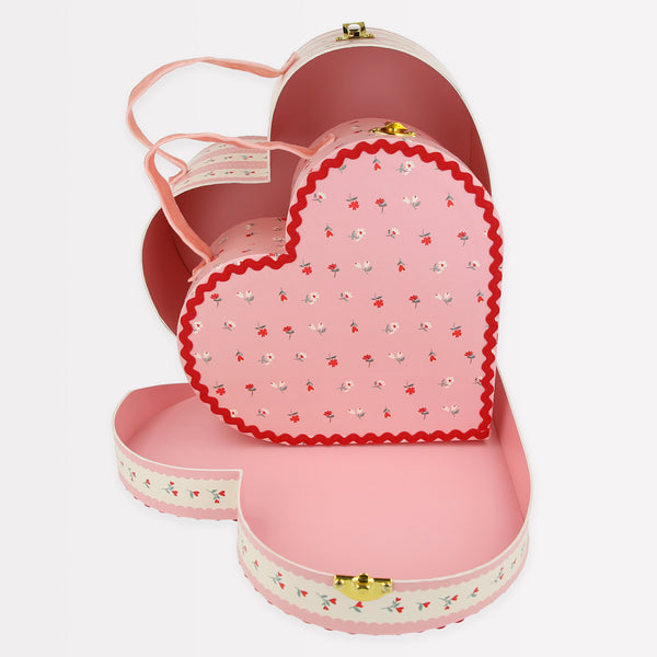 Our kids accessories feature heart suitcases in pink, red and white with soft velvet handles.