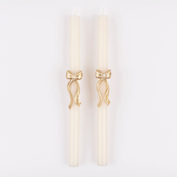 Our Christmas table candles have a stylish gold and white striped bow design to add sophistication to your dinner table or mantel. Image3