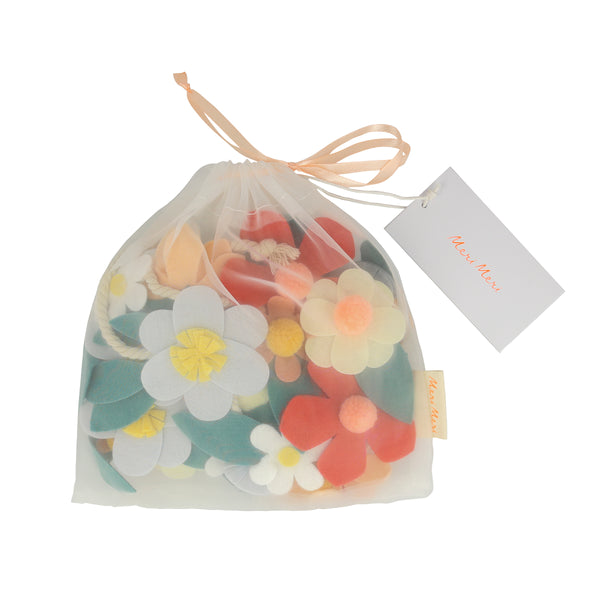 Our special party garland is crafted from felt, with flowers with pompom centers. Image6