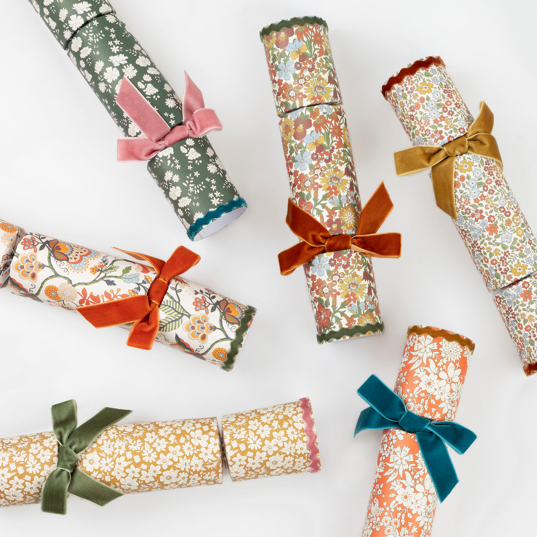 Our Thanksgiving party crackers feature Liberty floral prints, velvet bows and ric rac, containing a wooden brooch or keyring, party hat and joke. Image5