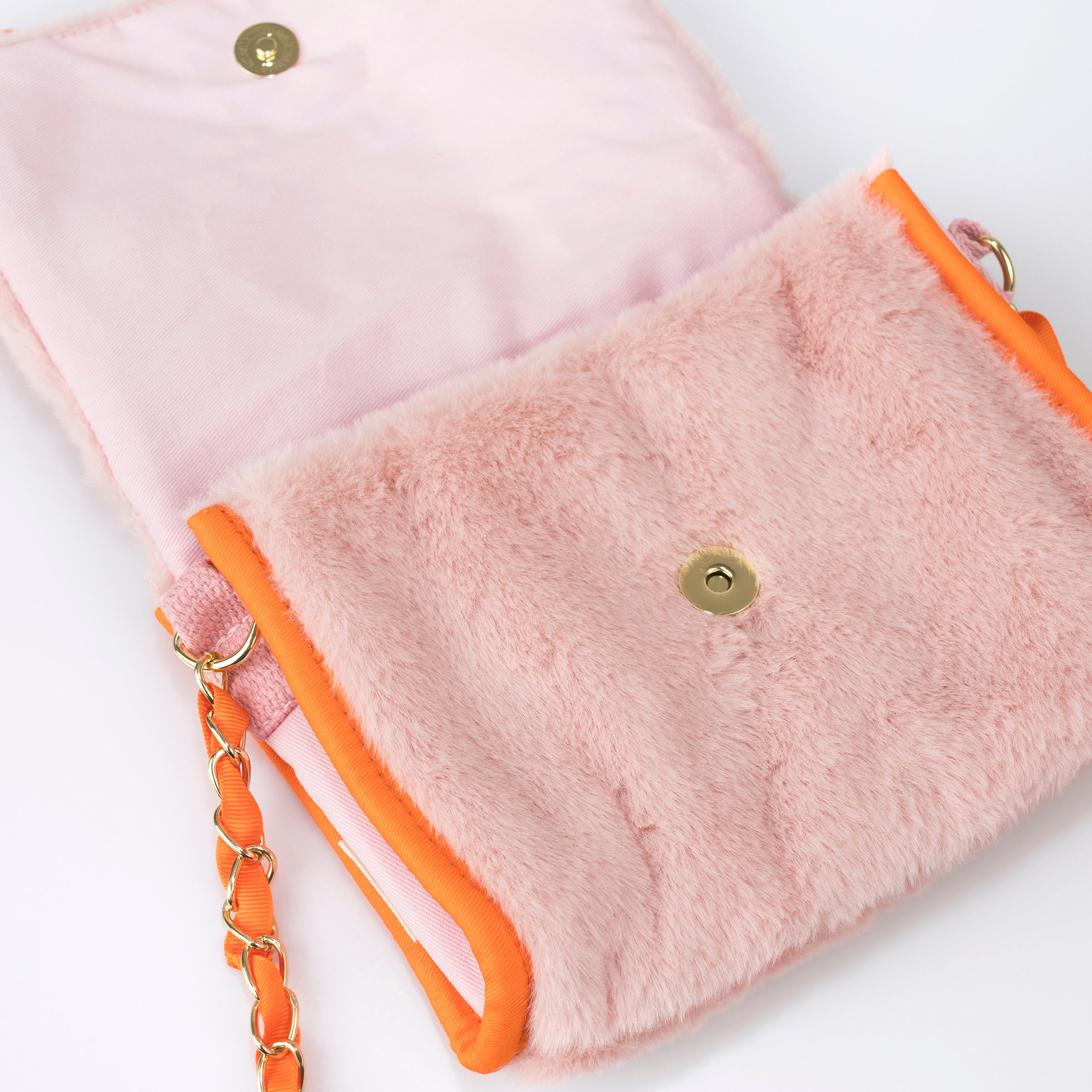 Our kids pink purse is crafted from soft plush in the shape of an adorable bunny with floppy ears.