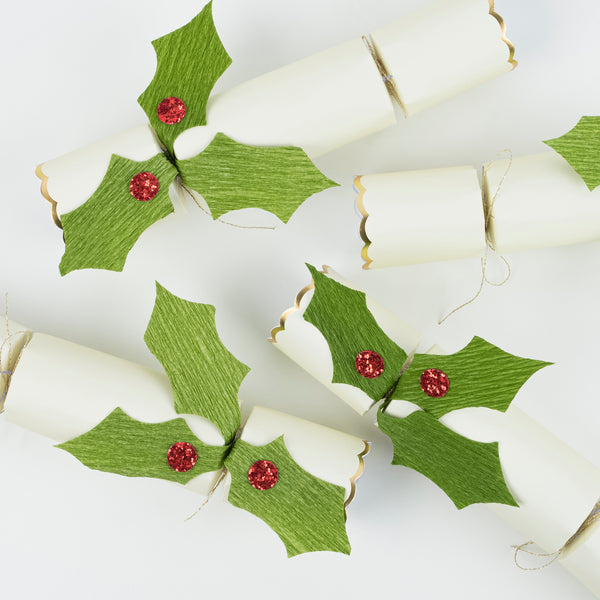 Our crackers are beautifully embellished with holly and berries, and contain Christmas brooches and gold party hats. Image3