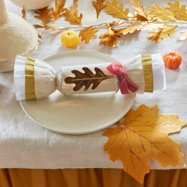 Our Thanksgiving crackers are made with crepe paper, golden leaves and velvet bows, and each have a luxury gift of a brooch or keyring. Image3