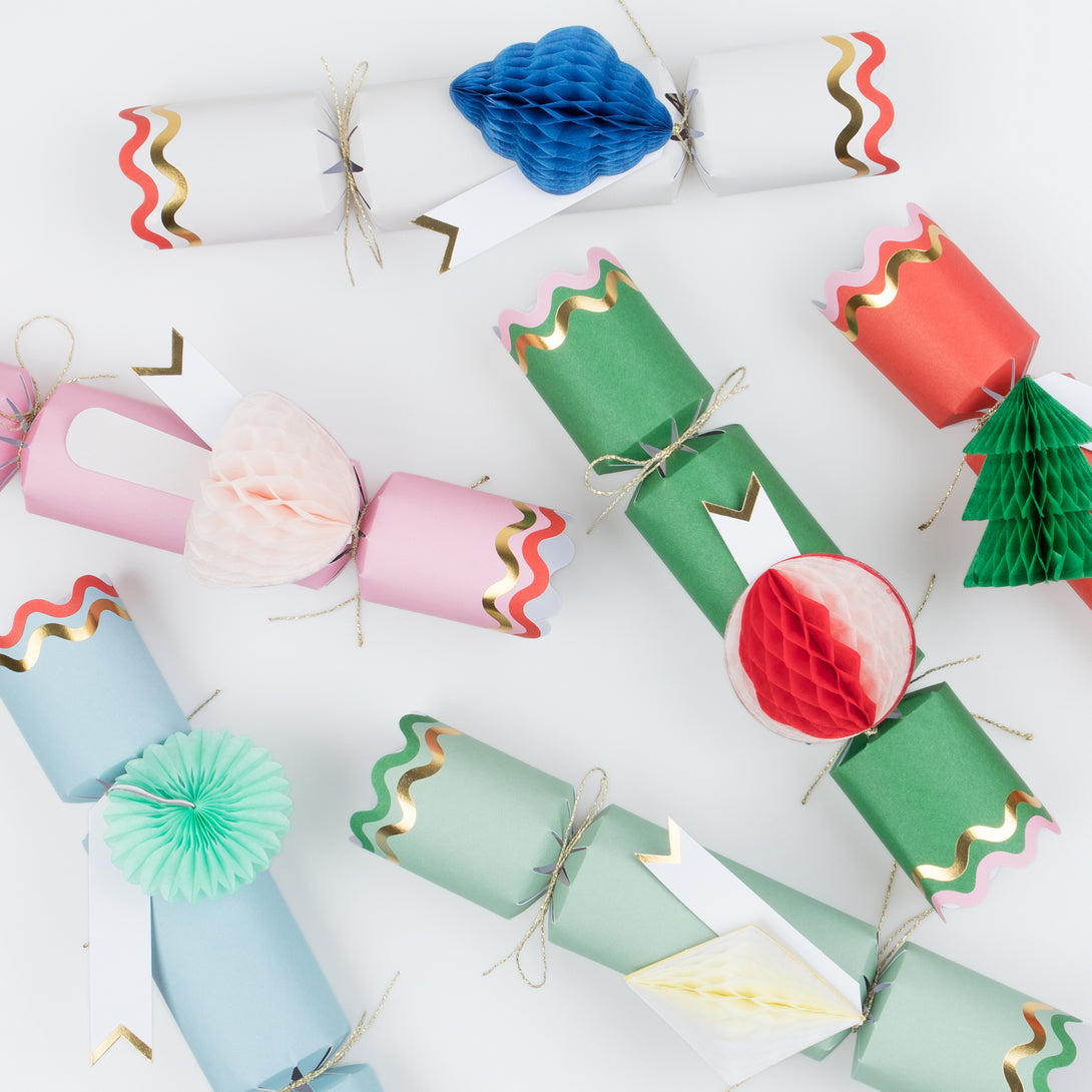 Our Christmas crackers have gift tags and fun honeycomb embellishments, and contain a joke, party hat and toy.