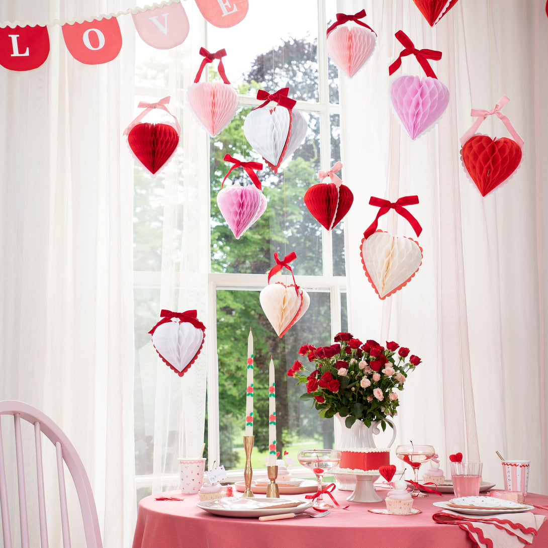 Our Valentine's hanging decorations, 3D honeycomb hearts in pink, red and cream with velvet ribbons, are perfect to set the scene for love