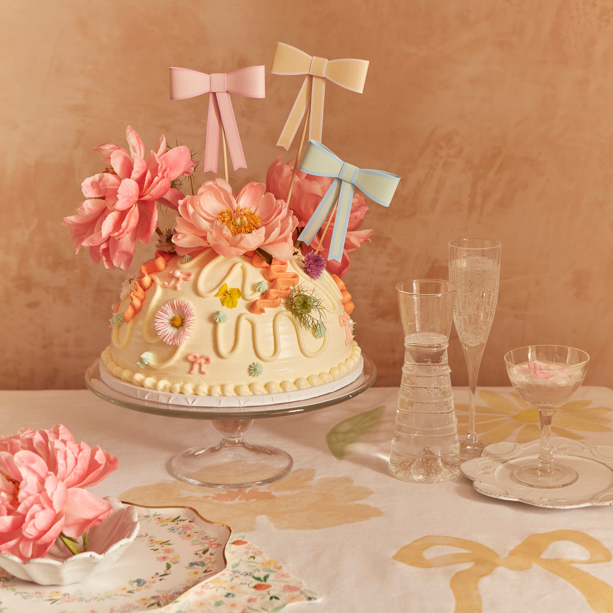 Our cake toppers feature pastel bows for an on-trend stylish look.