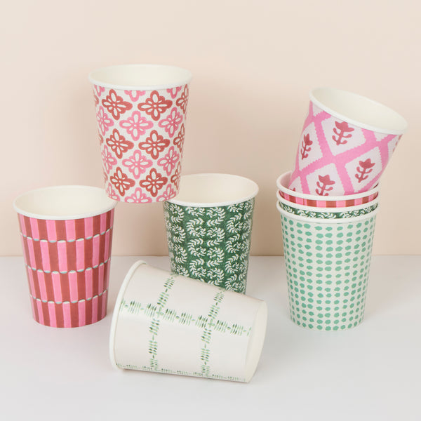 Our Christmas cups, made from paper, feature Molly Mahon block print designs in seasonal colors, perfect for hot and cold drinks. Image1