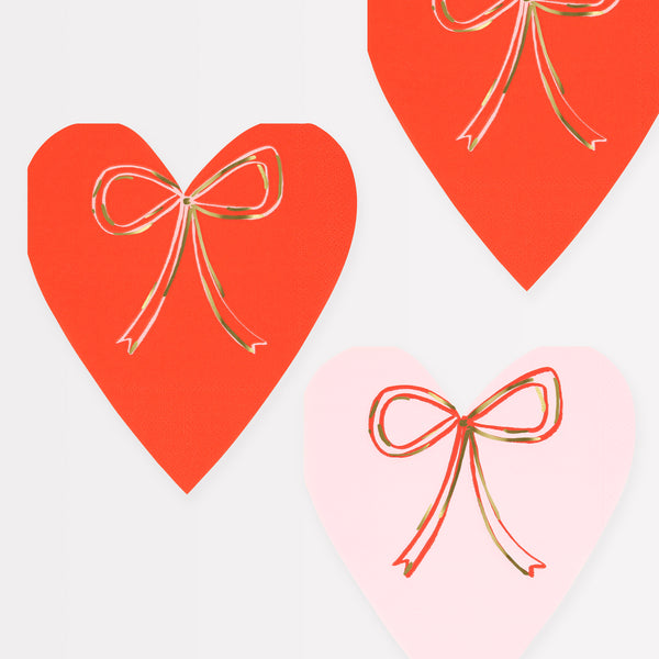 Our party napkins, crafted in the shape of hearts, featuring pink and red colors and fashionable bows.