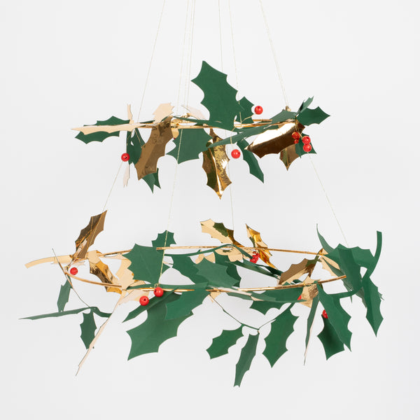 Our holly chandelier, made with metal, wood and paper, makes a beautiful hanging Christmas decoration.