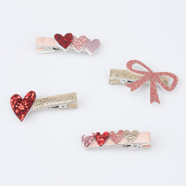 Our glitter hair clips, with pink and red glitter fabric, hearts, bows and a rainbow, are perfect as Valentine's gifts. Image3