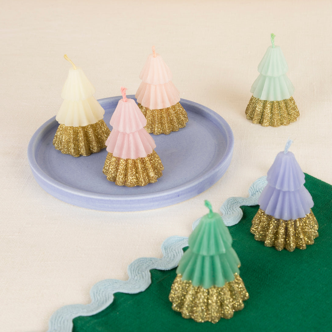 Our Christmas candles, in the shape of Christmas trees, are colorful and glittery, are perfect as a host gift.