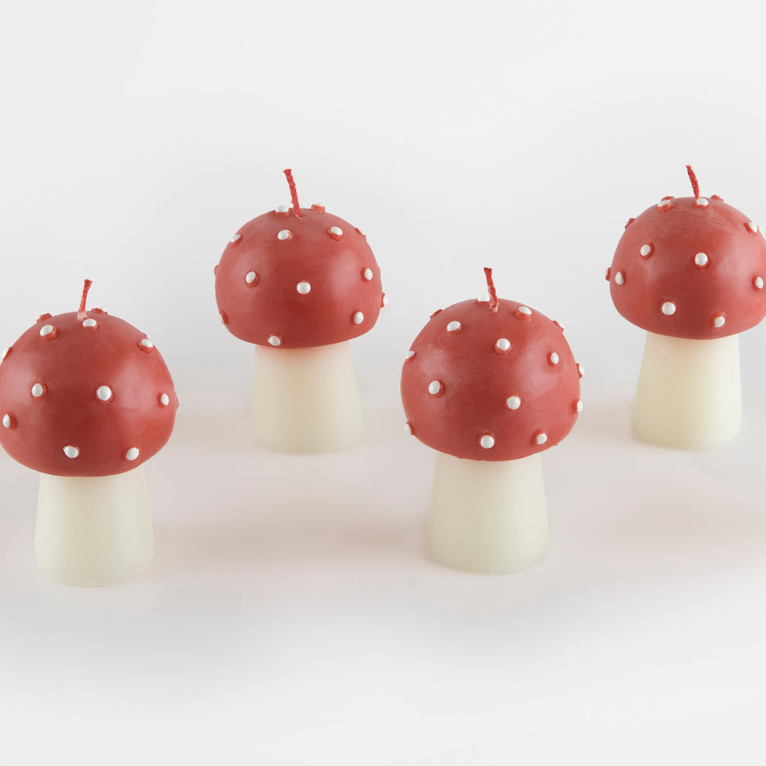 Our Christmas candles, are shaped like little mushrooms, in red and white with red wicks.