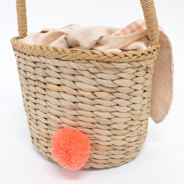 This basket is crafted from woven straw, with floppy ears, a sweet bunny face and a dellightful pompom tail. Image3