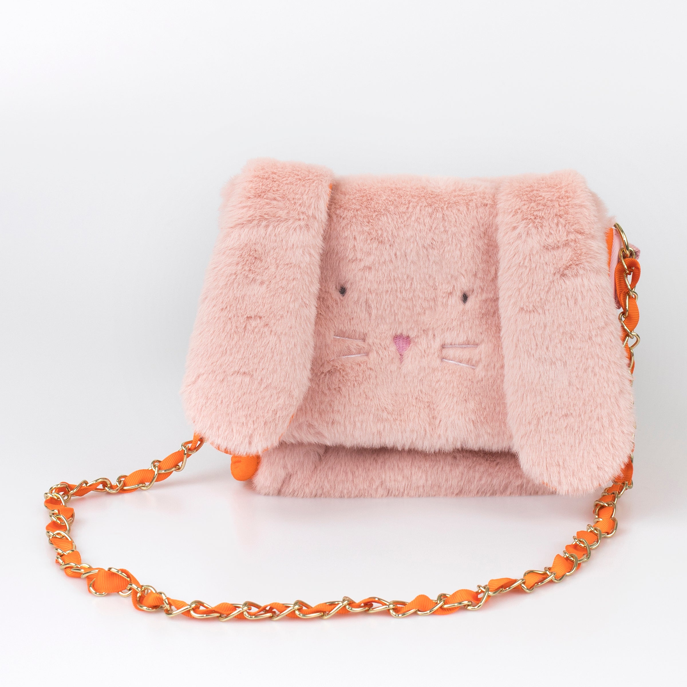 Our kids pink purse is crafted from soft plush in the shape of an adorable bunny with floppy ears.