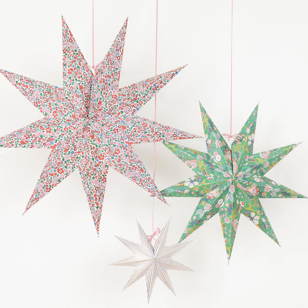 Our Christmas hanging decorations, in the shape of stylish 3D stars, feature beautiful Liberty floral prints in festive colors. Image1