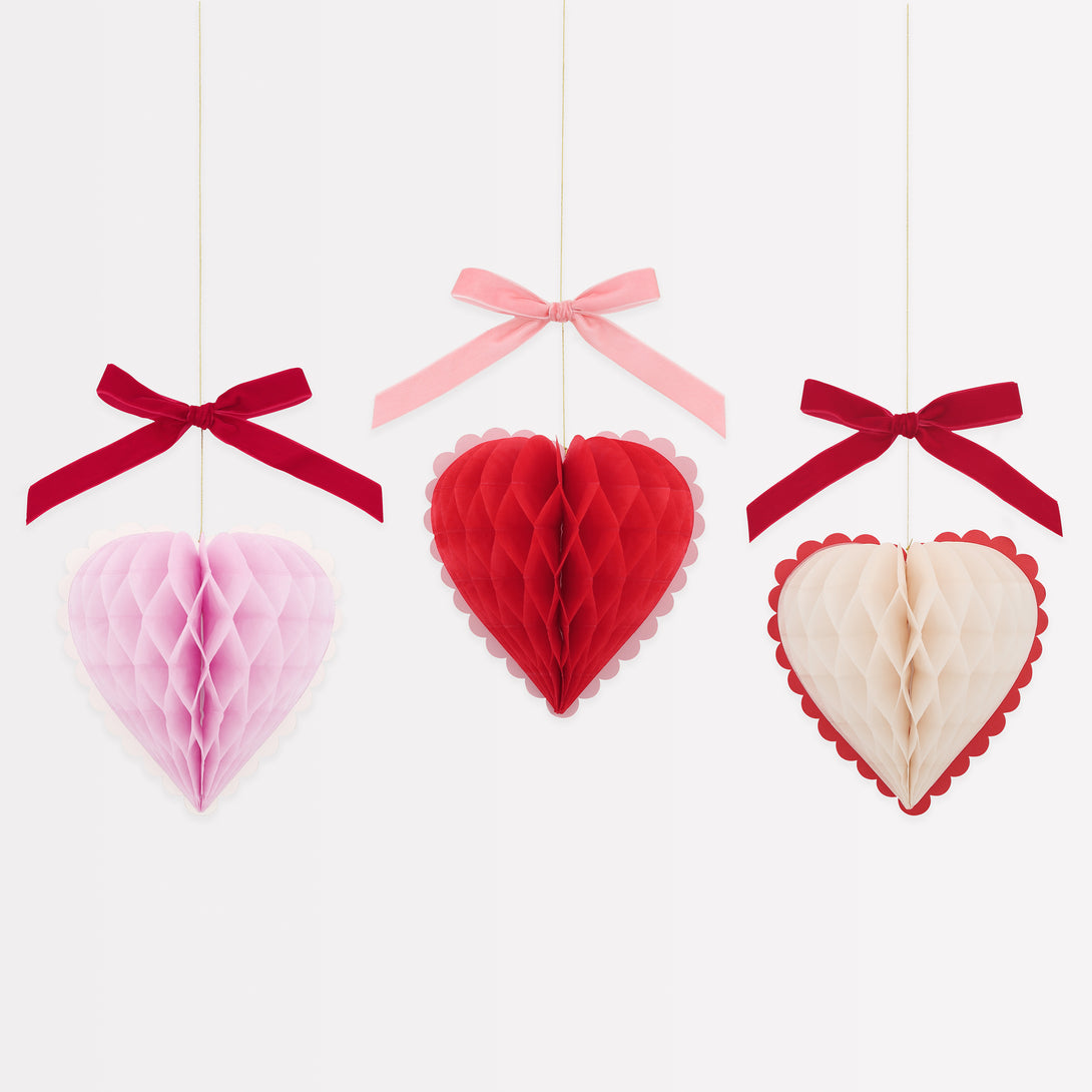 Our Valentine's hanging decorations, 3D honeycomb hearts in pink, red and cream with velvet ribbons, are perfect to set the scene for love